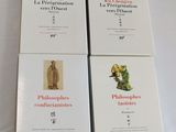 four books on a white table with a white table cloth
