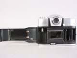 a black and white photo of an old camera