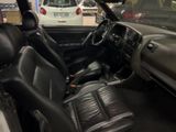 dashboard of a car with black leather seats in a showroom