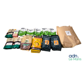 many bags of food that are sitting on a table