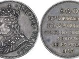 a close up of a coin with a crown on it