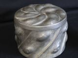 a marble box sitting on a black surface