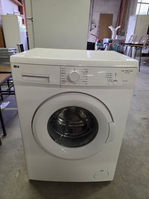 a washing machine that is sitting in the middle of a room