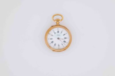 a gold pocket watch with roman numerals and roman numerals