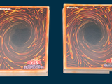 two cards that are sitting next to each other on a table