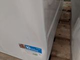two refrigerators that are sitting on a pallet