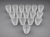 a group of glasses sitting on top of a table next to each other