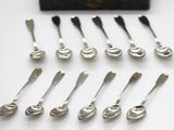a lot of spoons that are sitting on a table