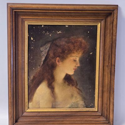 portrait of a young woman in a white dress with a veil on her head