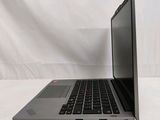 laptop computer sitting on a white surface with a white background