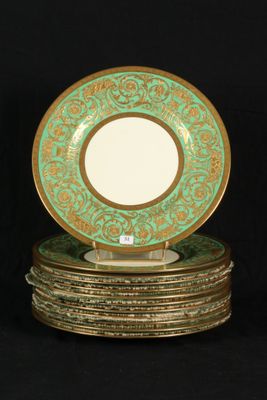 four plates stacked on top of each other on a black surface