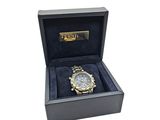 the watch is in a box with a black velvet cover