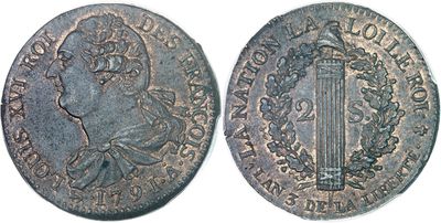 une pièce d'argent sur laquelle figure l'effigie d'un homme coiffé d'une couronne