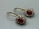 une paire de boucles d'oreilles en rubis et diamants