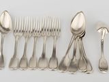 five spoons and six forks on a white table