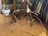 a toy horse on a bicycle in a living room