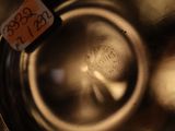 a close up of a glass of water with a tag on it