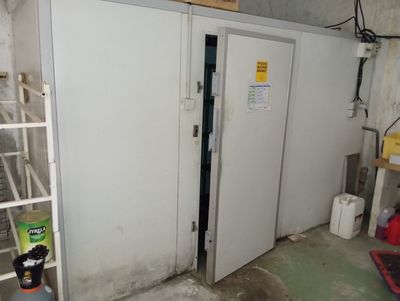 a room with two doors and a ladder in it