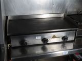 stainless steel counter top with two burners and a griddle top