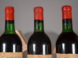 three bottles of wine sitting next to each other on a table