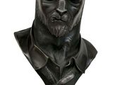 bust of a man with a cat ' s head on a black base