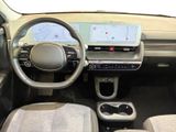 the interior of a small car with a steering wheel and dashboard
