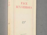 the front cover of a book with a picture of a face on it