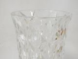 a glass vase that is sitting on a table