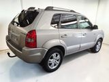 a picture of a silver suv parked in a garage