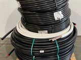 several black and white hoses stacked on top of each other