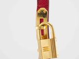 a close up of a red belt with a lock on it