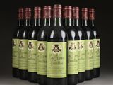 six bottles of wine are lined up in a row on a table