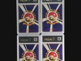 four nintendo wii game cards in plastic cases on a black background