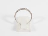 a close up of a silver ring on a white surface