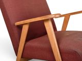 an image of a red chair with a wooden frame
