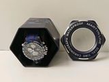 a watch in a black box on a white table