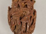 a close up of a piece of wood with carvings on it