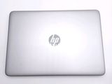 a laptop that is sitting on a white table