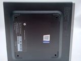 the back of a laptop with the lid open on a white surface