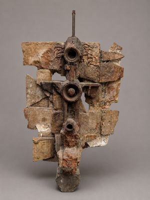 an image of a sculpture of a cross made out of rocks