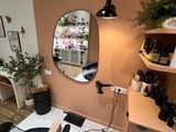 a room with a chair and a mirror on the wall
