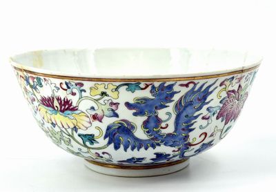 a white bowl with blue and yellow designs on it