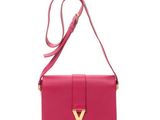 a pink y bag with a gold y logo on the front
