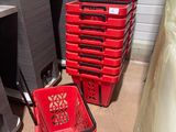 many red baskets sitting on the floor next to each other