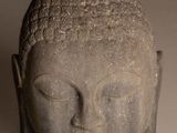 statue of a head of a person with a short hair