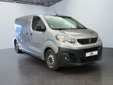 a picture of a silver van parked in a garage