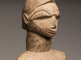 an image of a statue of a person with a hat on