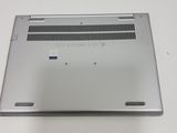 a silver laptop that is sitting on a white table