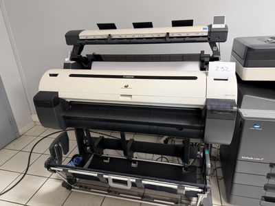 a large printer sitting on top of a printer stand