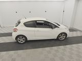 a picture of a white car parked in a garage
